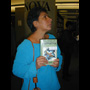 2005 10 17 05 Rebecca Belmore holding Song of Hiawatha book in Nova Library