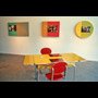 1996 06 04 The Mattering Map Project Pia Massie 04 installation view 3 pieces on wall yellow table red chairs in foreground