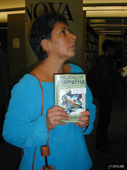 2005 10 17 05 Rebecca Belmore holding Song of Hiawatha book in Nova Library